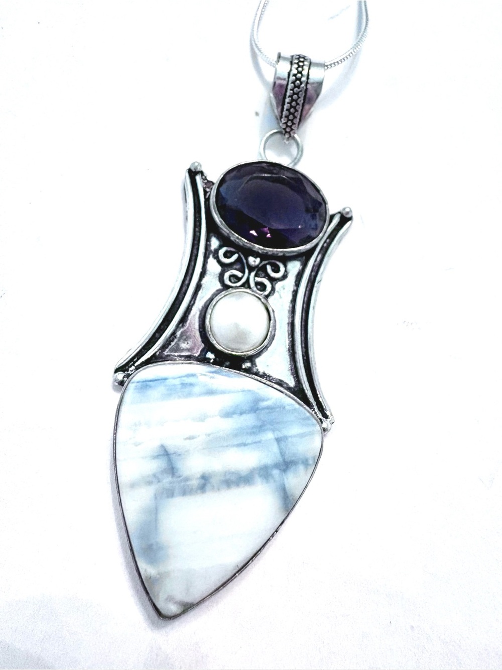 Pretty, 3 inch, 925  marked, Owyhee Opal,  Pear and Amethyst on a silver chain.